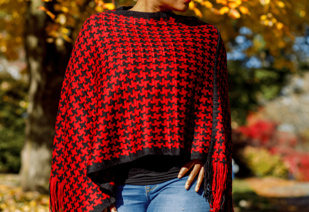 This is a one size fits most red and black houndstooth poncho. Sits right at at the waist and just the right touch of fringe on part of the hem.